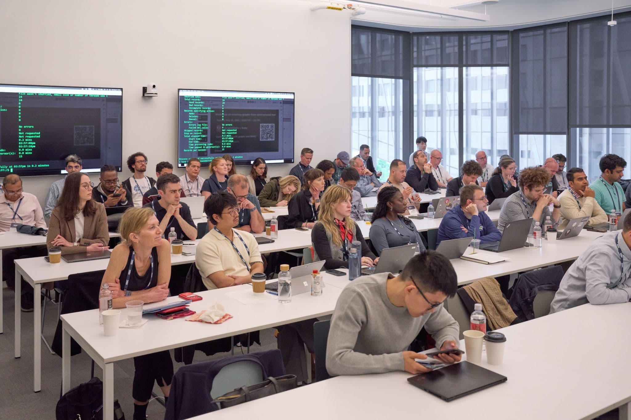 A workshop in progress, an instructor at the front and the room following along.